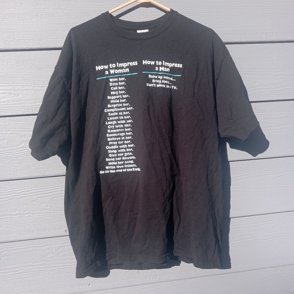 Men's How to Impress a Woman vs. How to Impress a Woman Black T Shirt Size XL - Picture 1 of 3